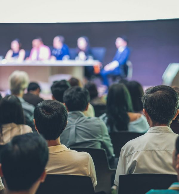 rear-view-of-audience-in-the-conference-hall-or-se-2022-12-16-03-32-42-utc-1-1.jpg